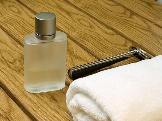 men's toiletries include cologne and a shaving razor